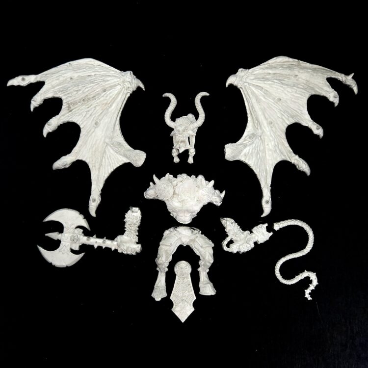 A photo of a Chaos Daemons Bloodthirster Greater Daemon of Khorne Warhammer miniature