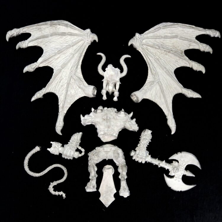A photo of a Chaos Daemons Bloodthirster Greater Daemon of Khorne Warhammer miniature