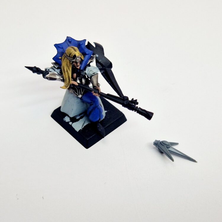 A photo of a High Elves Mage Warhammer miniature