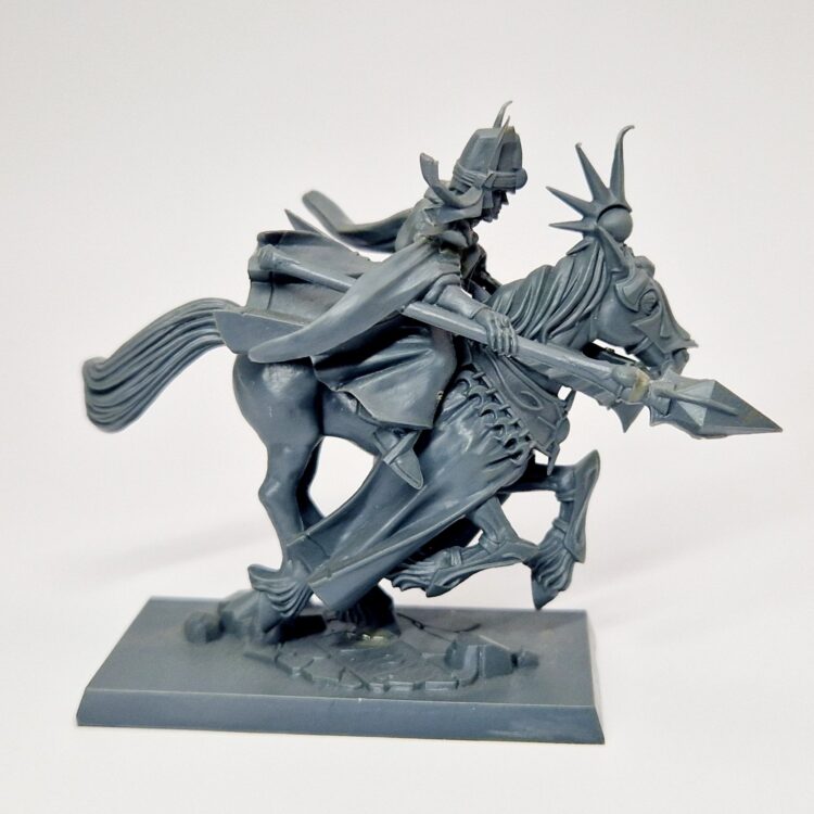 A photo of a High Elves Mage Warhammer miniature