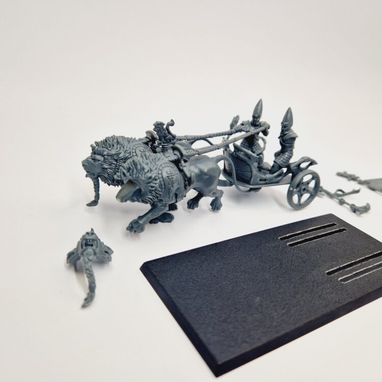 A photo of a High Elves Lion Chariot of Chrace Warhammer miniature