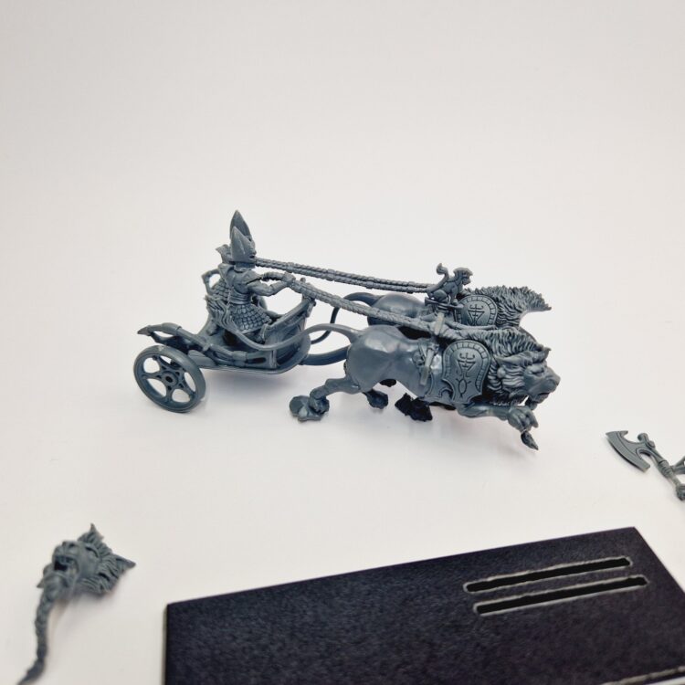 A photo of a High Elves Lion Chariot of Chrace Warhammer miniature