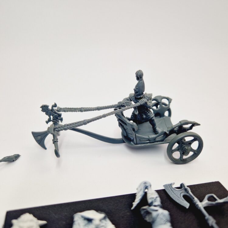 A photo of a High Elves Lion Chariot of Chrace Warhammer miniature