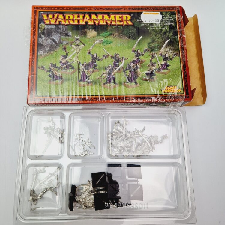 A photo of Dogs of War Mengil Manhide's Manflayers Warhammer miniatures