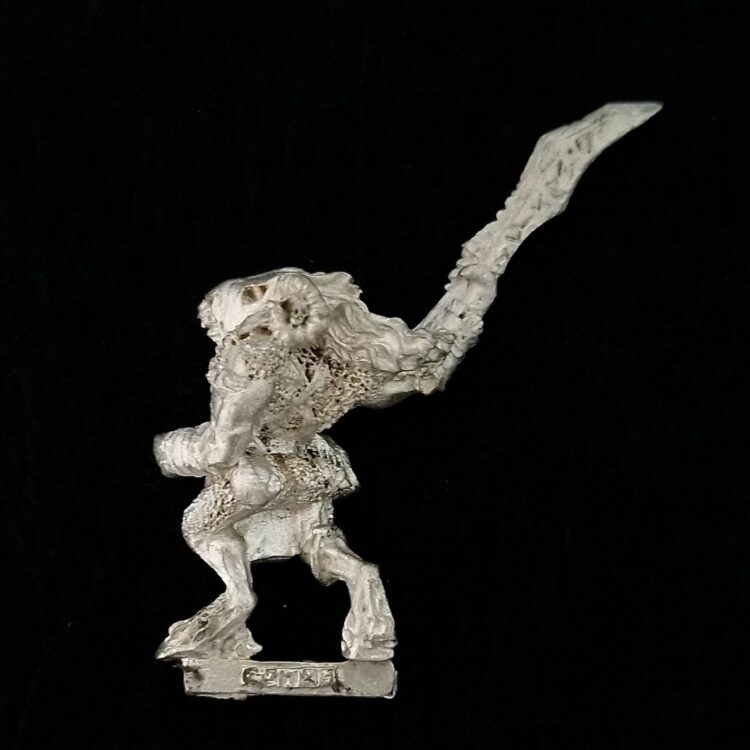 A photo of a Mordheim Cult of the Posessed Beastman Warhammer miniature