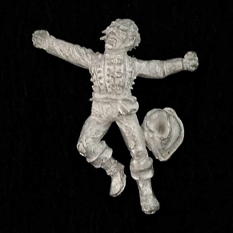 A photo of a Mordheim Human Casualty Warhammer miniature