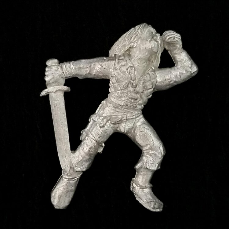 A photo of a Mordheim Human Casualty Warhammer miniature