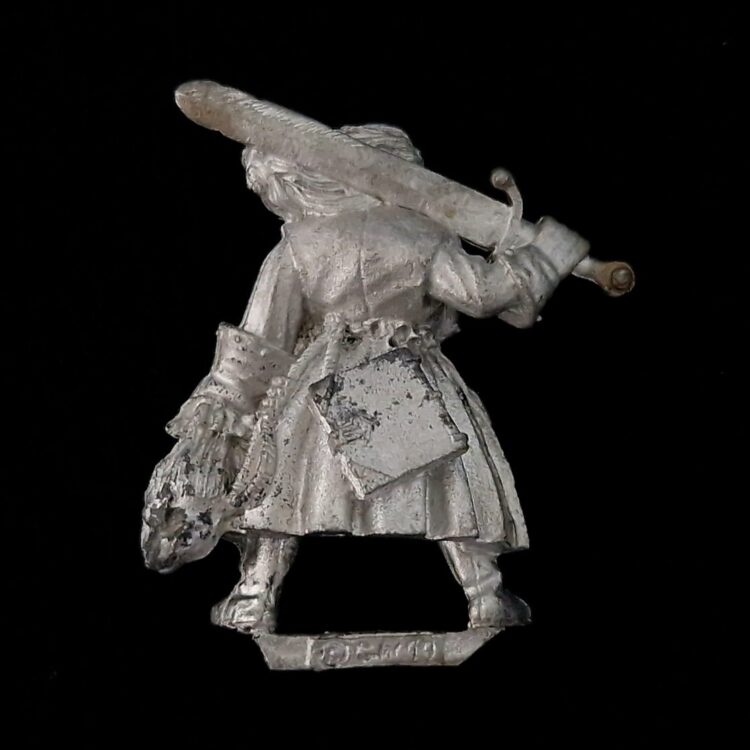 A photo of a Mordheim Witch Hunters Captain Warhammer miniature