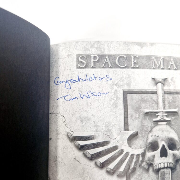 A photo of a Warhammer Limited 4th Edition Space Marines Codex Signed