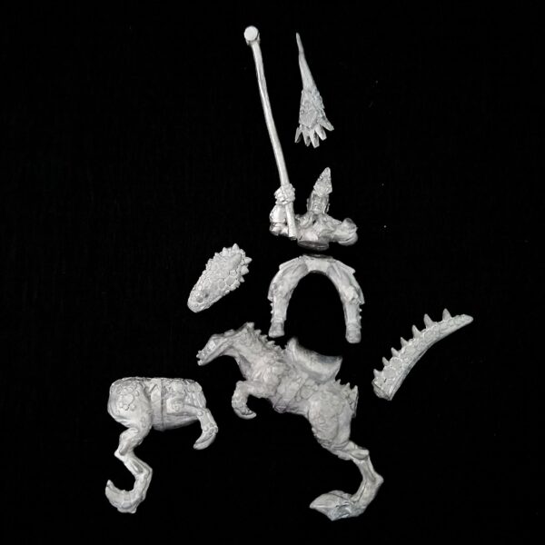 A photo of a Dark Elves Cold One Knight Standard Bearer Warhammer miniature