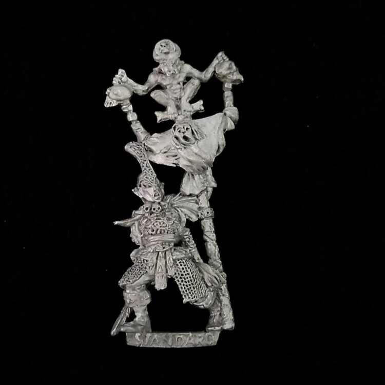 A photo of a Dark Elves Warriors Standard Bearer Warhammer miniature