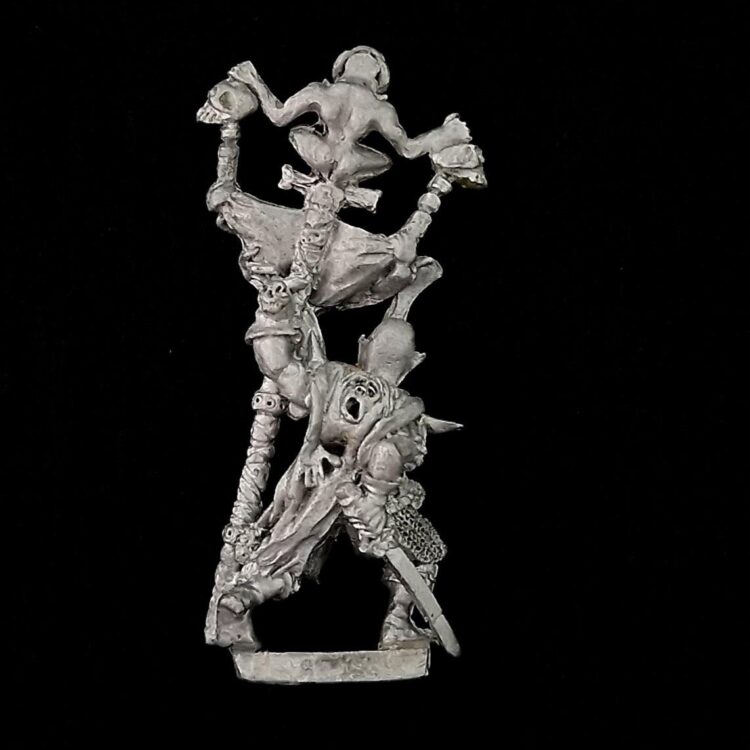 A photo of a Dark Elves Warriors Standard Bearer Warhammer miniature