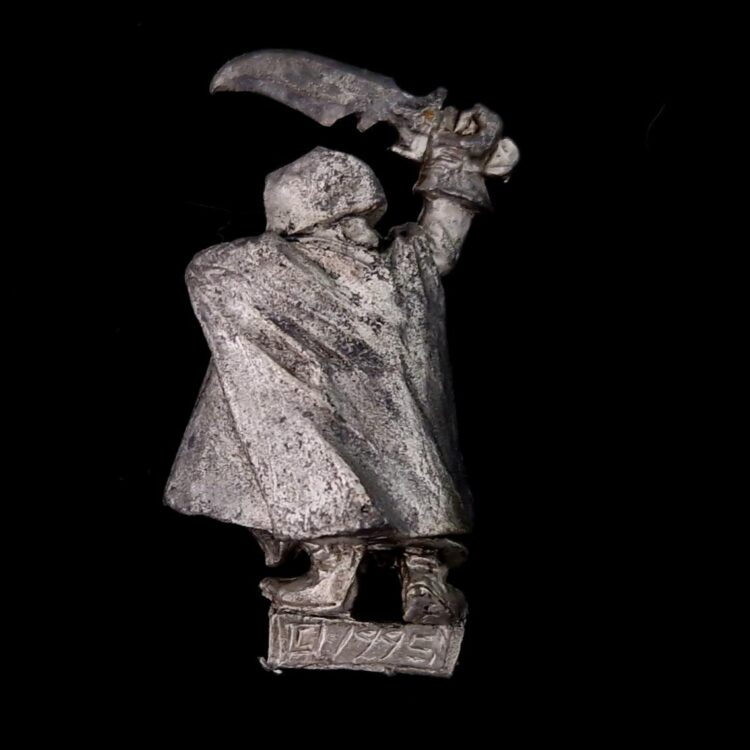 A photo of a Dark Elf Assassin Warhammer miniature