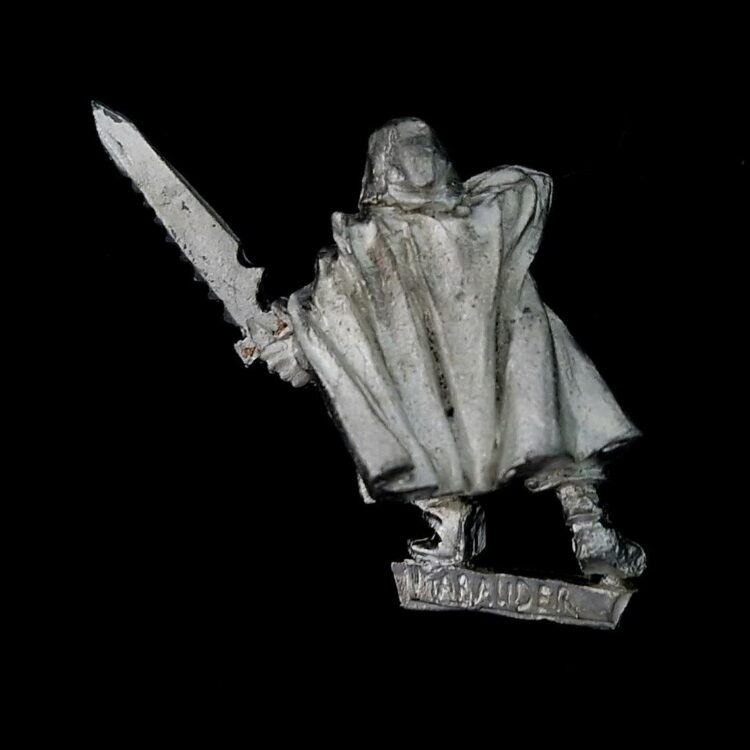 A photo of a Dark Elf Assassin Warhammer miniature