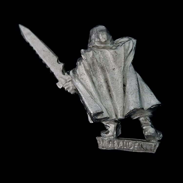 A photo of a Dark Elf Assassin Warhammer miniature