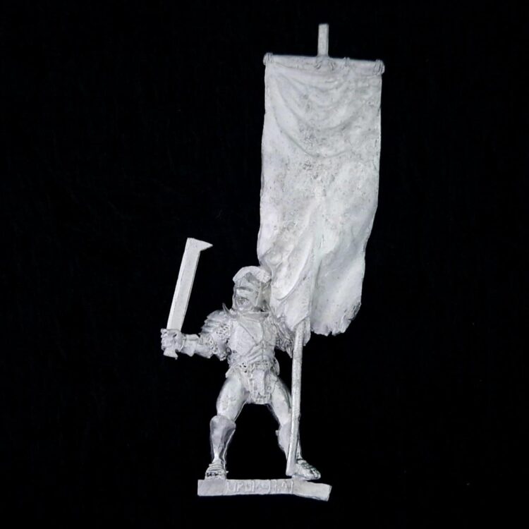 A photo of a Isengard Uruk-Hai Banner Bearer Middle Earth Warhammer miniature