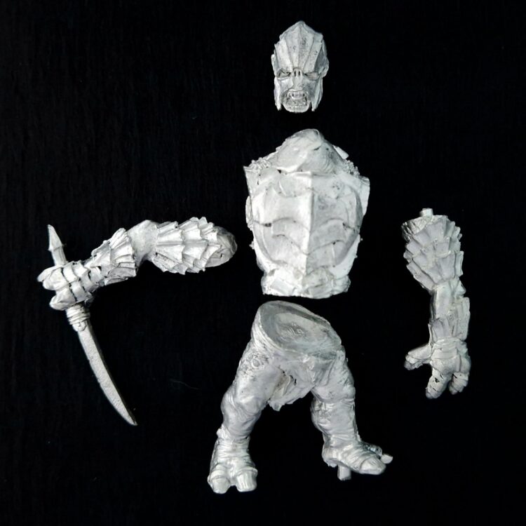 A photo of a Mordor Troll Chieftain Middle Earth Warhammer miniature