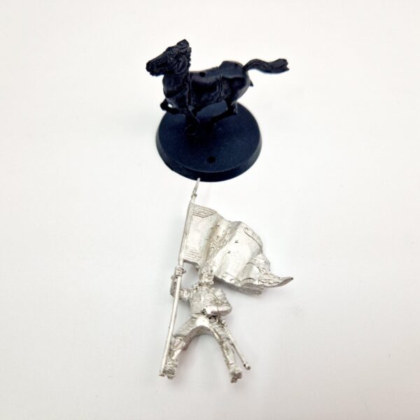 A photo of a Knight of Minas Tirith Banner Bearer Middle Earth Warhammer miniature