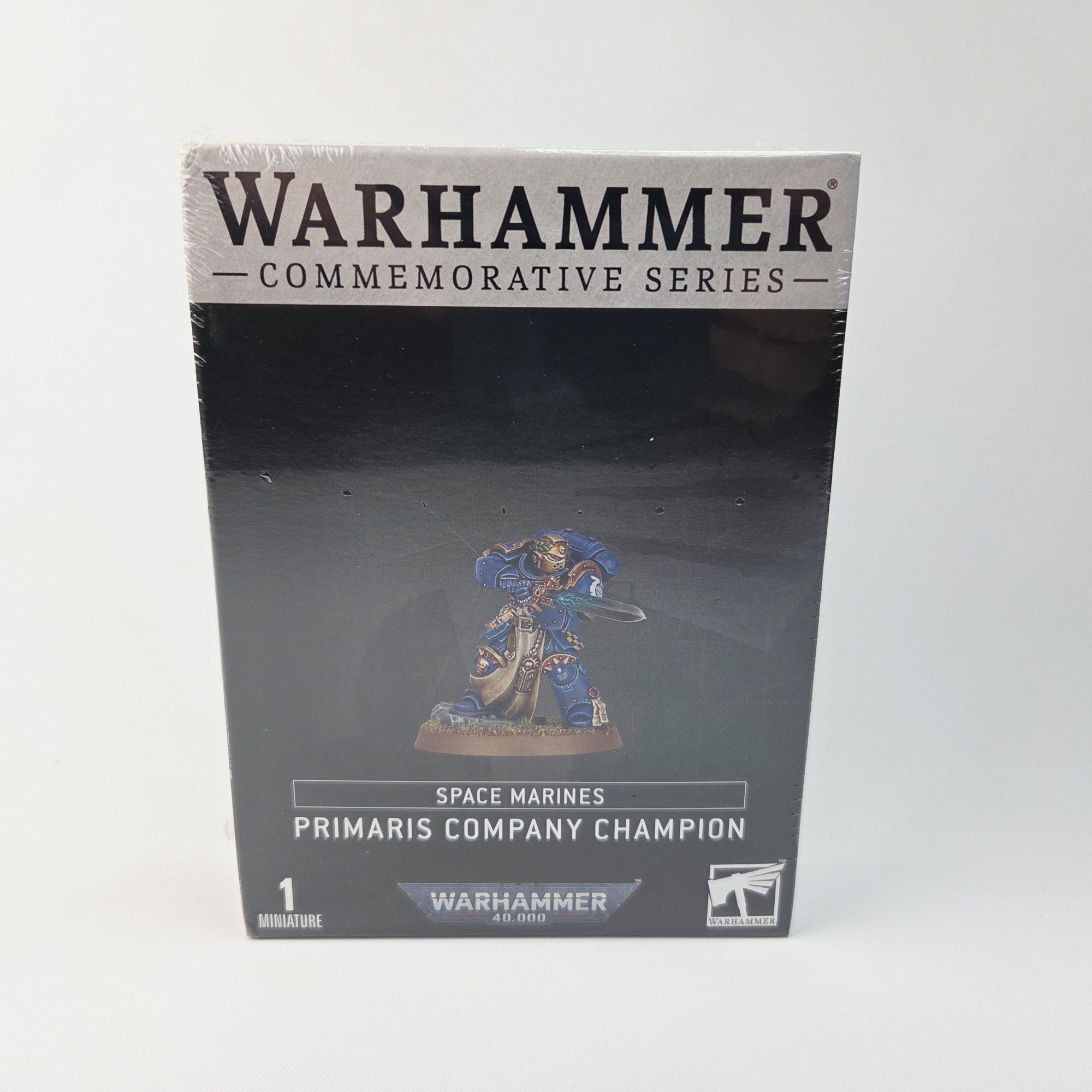 A photo of a Space Marines Commemorative Series Primaris Company Champion Warhammer miniature