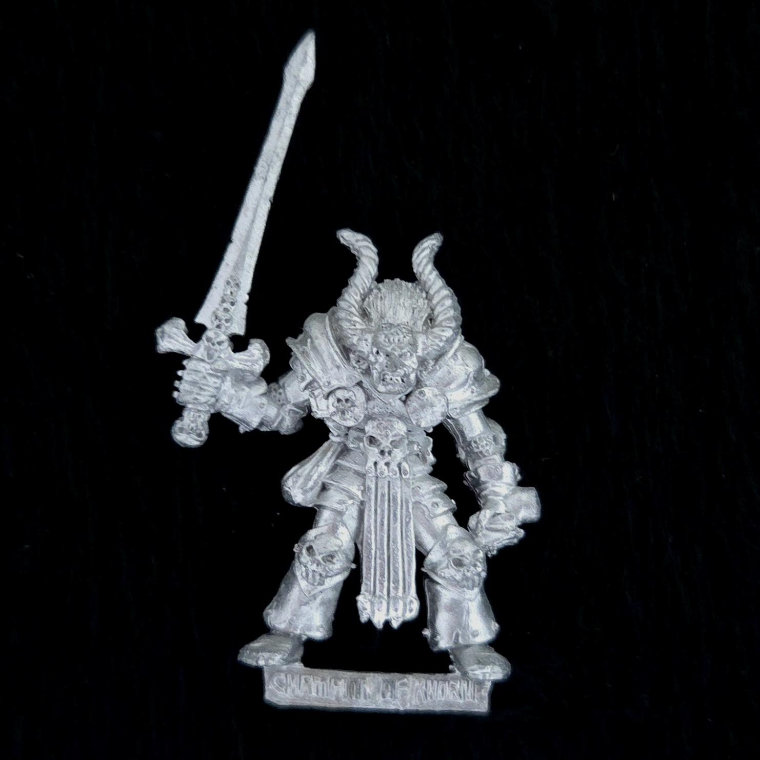 A photo of a Chaos Warriors Champion of Khorne Warhammer miniature