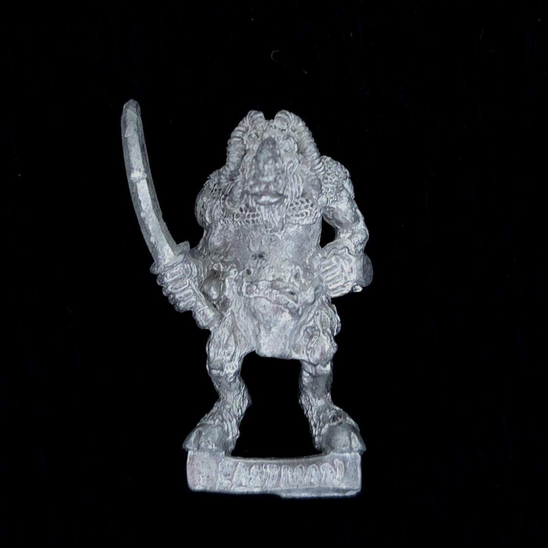 A photo of a Beasts of Chaos Beastman Warhammer miniature