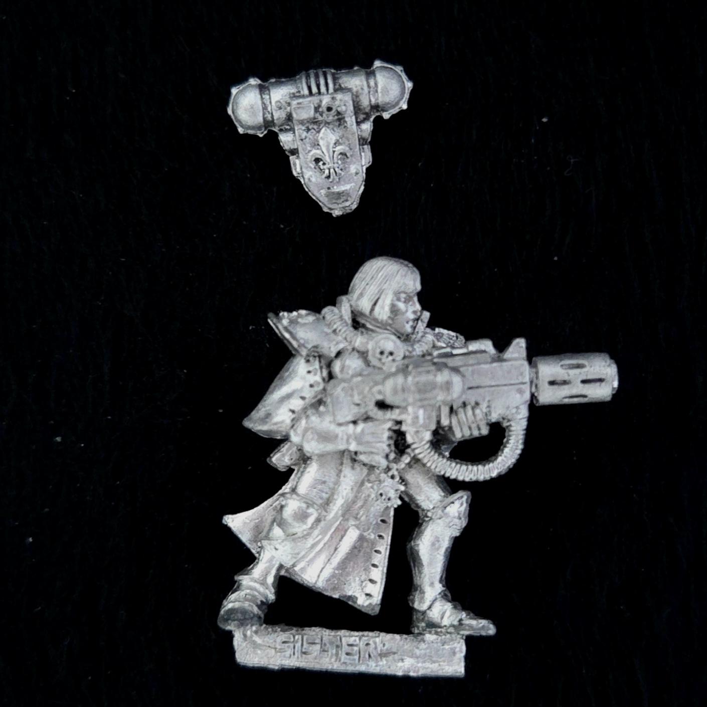 A photo of a Sisters of Battle Battle Sister with Melta Gun Warhammer miniature