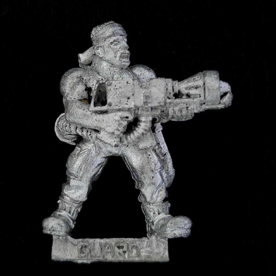 A photo of a Imperial Guard Catachan Jungle Fighters Flamer Warhammer miniature