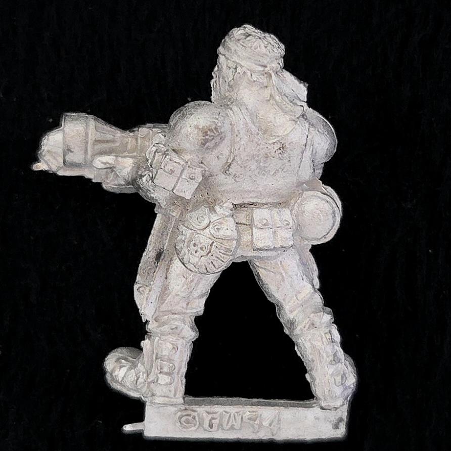 A photo of a Imperial Guard Catachan Jungle Fighters Flamer Warhammer miniature