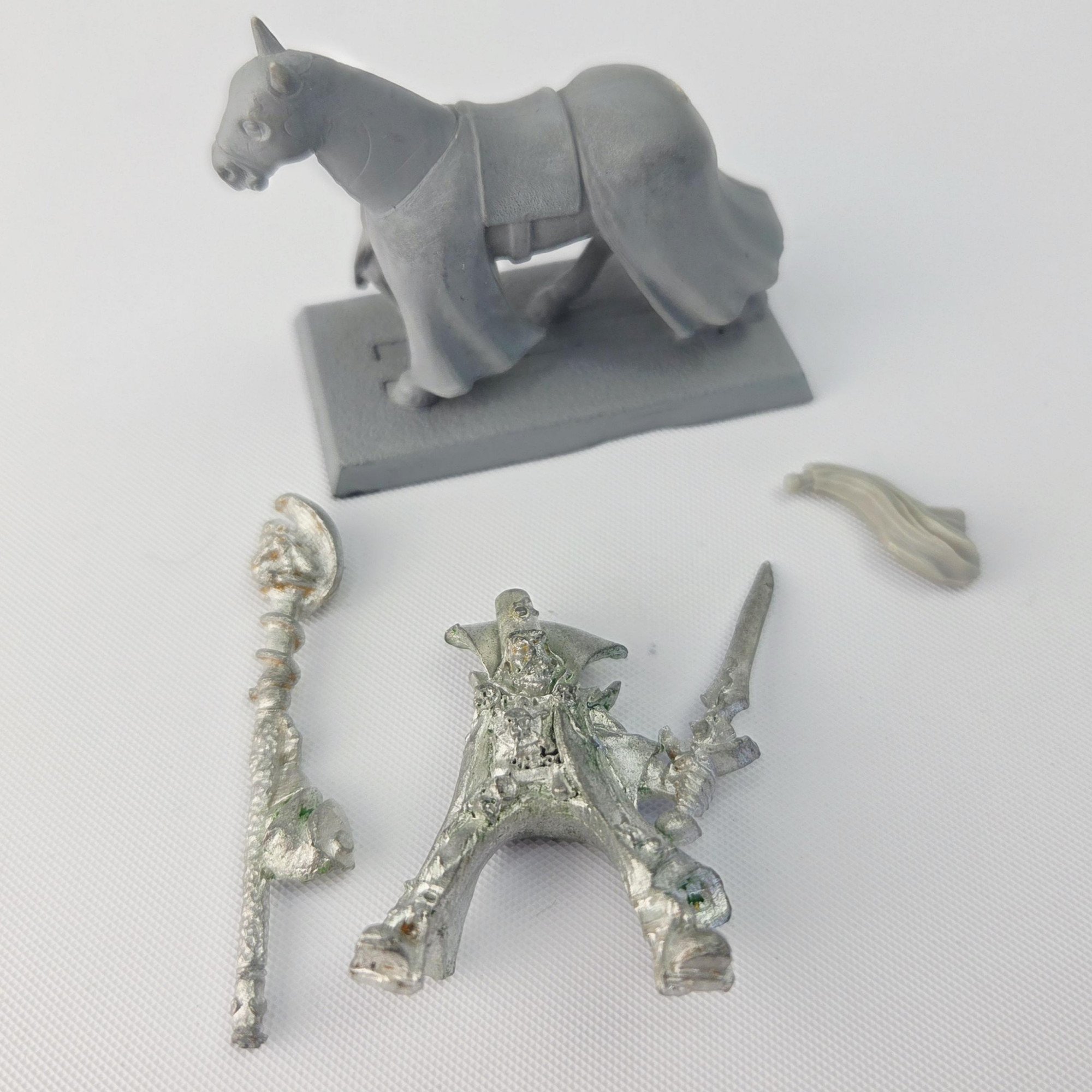 A photo of a The Empire Mounted Gold Wizard Warhammer miniature