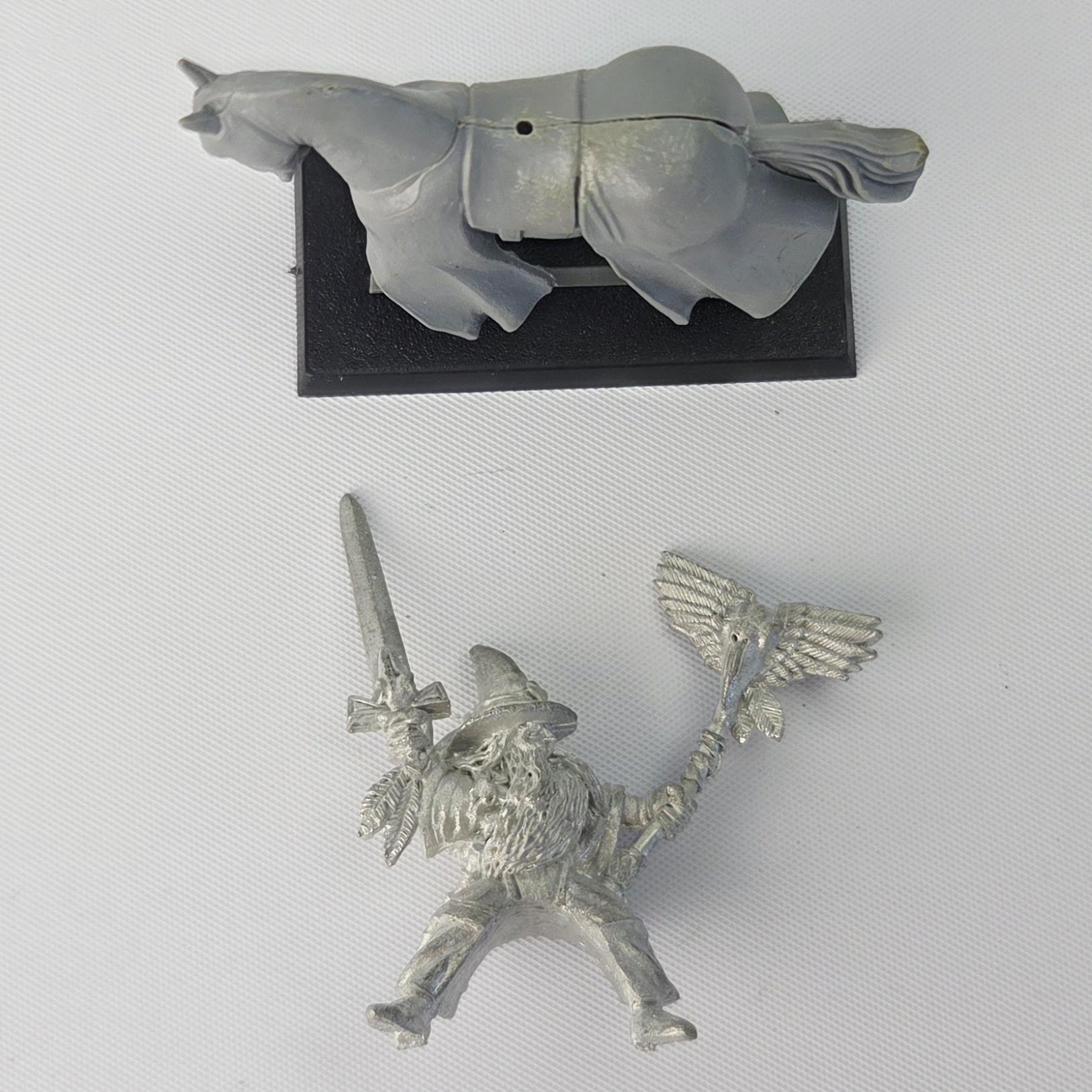 A photo of a The Empire Mounted Grey Wizard Warhammer miniature