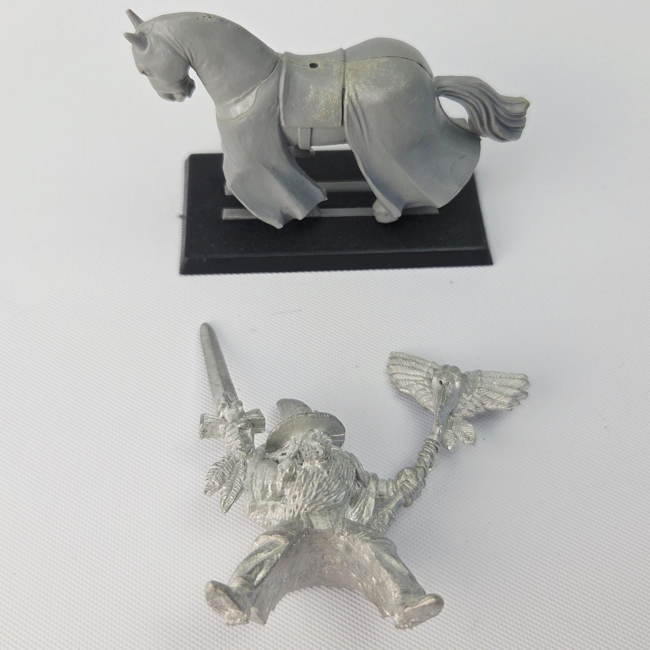A photo of a The Empire Mounted Grey Wizard Warhammer miniature