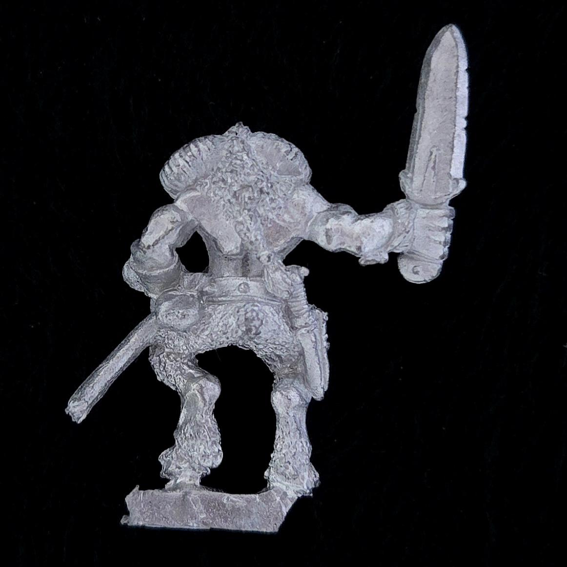 A photo of a Beasts of Chaos Marauder Beastman Warhammer miniature