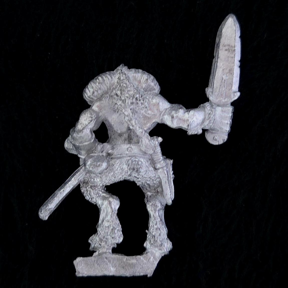 A photo of a Beasts of Chaos Marauder Beastman Warhammer miniature