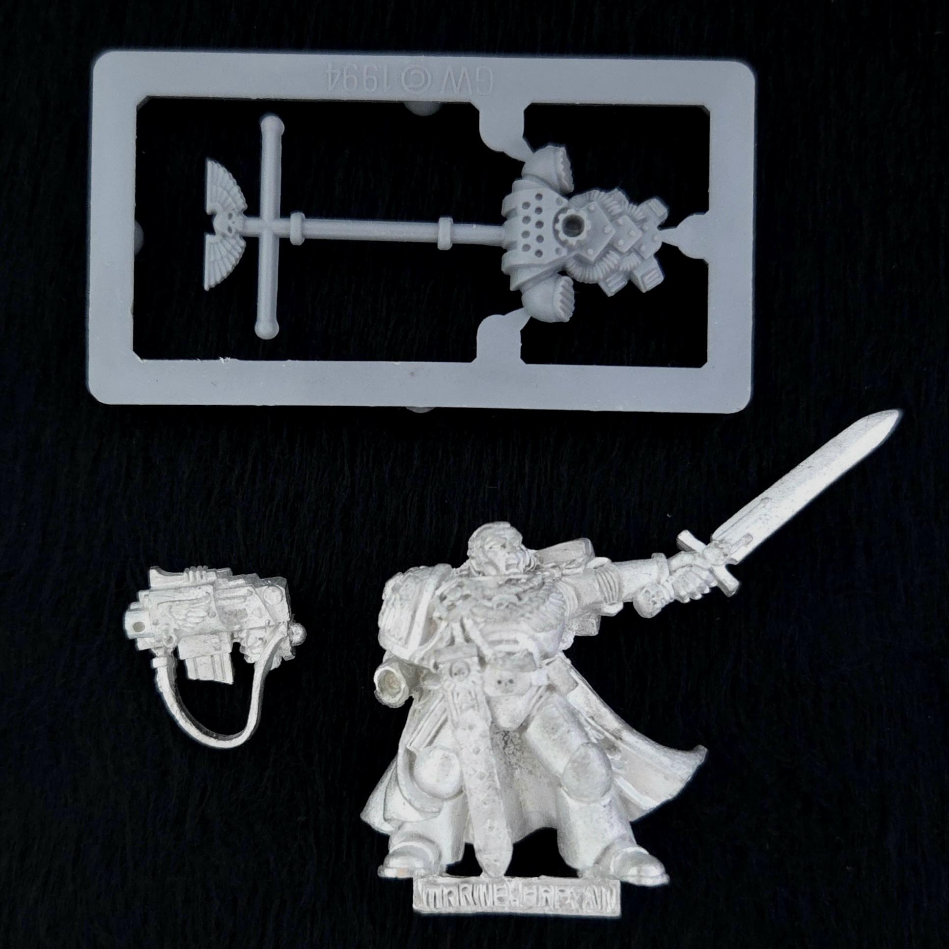 A photo of a Space Marines Commander Warhammer miniature