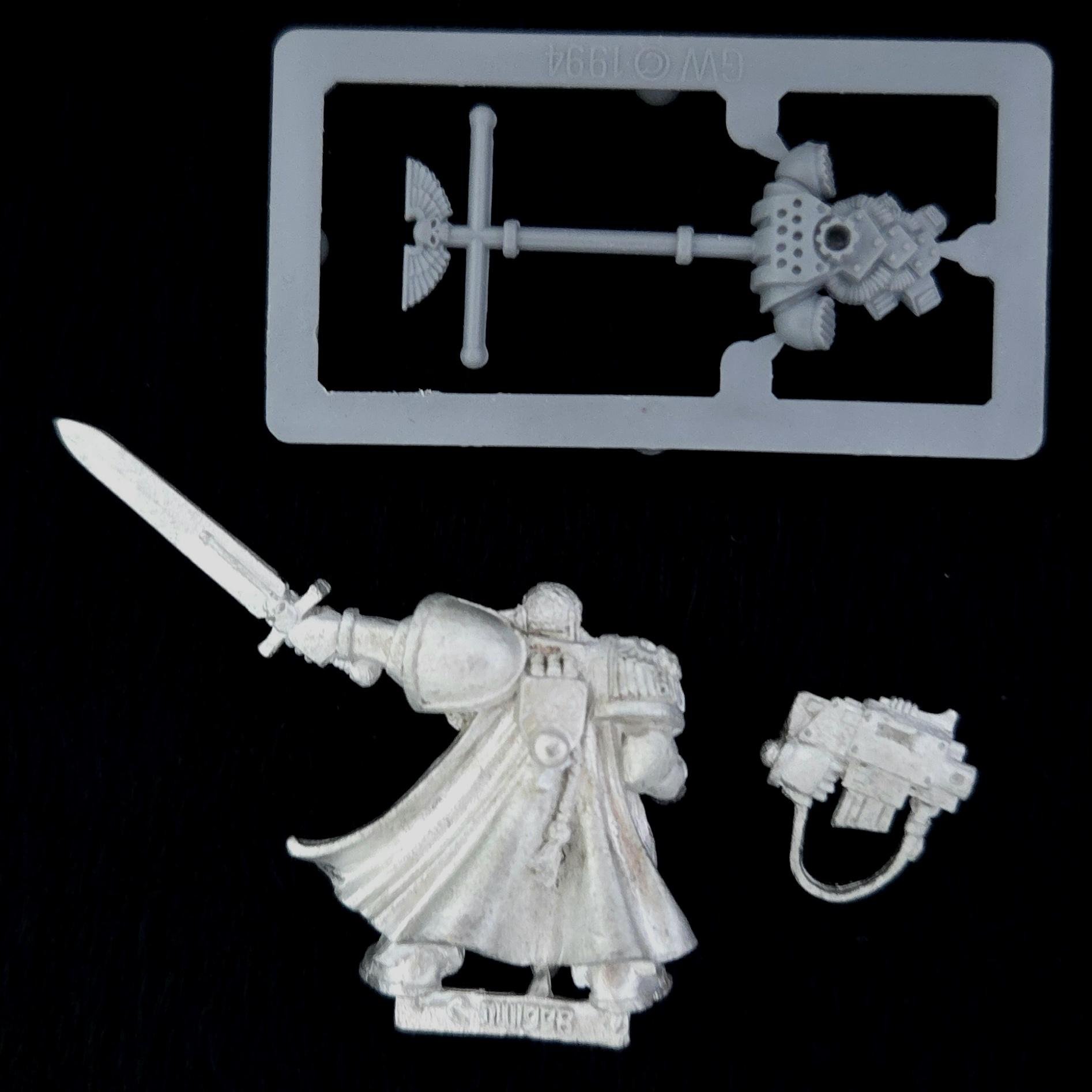 A photo of a Space Marines Commander Warhammer miniature