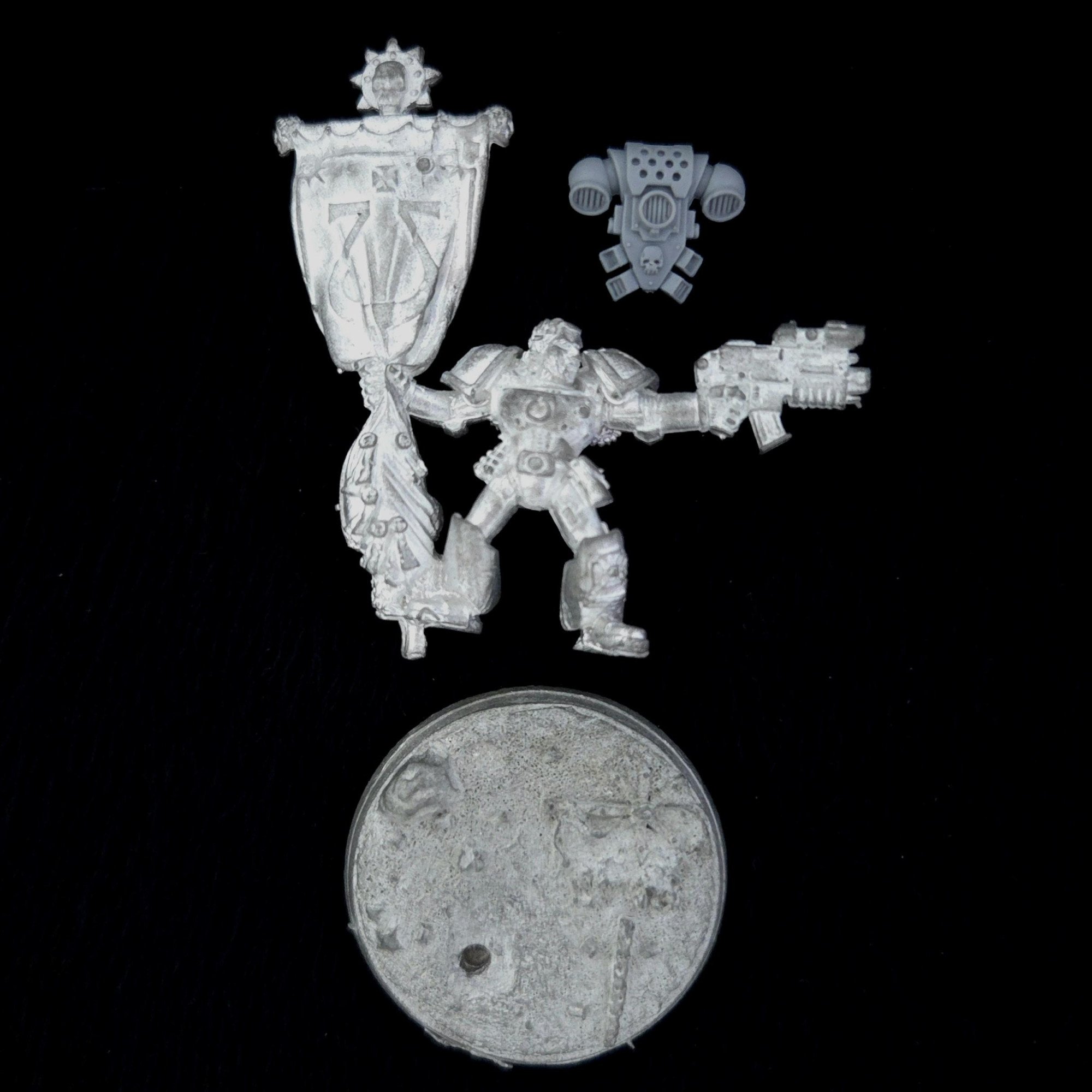 A photo of a Space Marines Skullz Limited Edition Standard Bearer Warhammer miniature